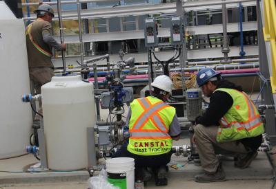 Team Canstal Heat Trace installing heat trace system on pipes for oil and gas refinery in Houston Texas.