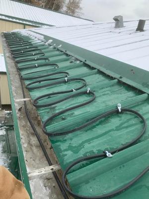 Gutter, downspout and roof zig zag heat trace trace_ snow melting system installed in Salt Lake City Utah.