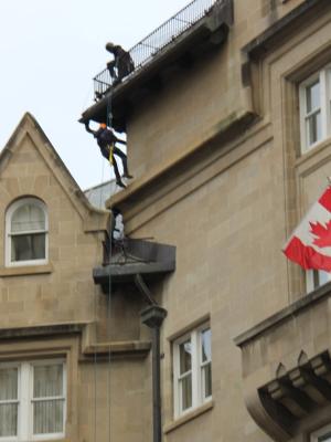 Snow melting system installed for downspouts, roof and gutters for a hotel in Edmonton Alberta Canada.